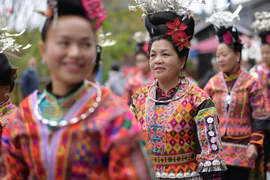 A Chinese villager of Miao ethnic group wearing traditional costumes  practises ''Miao stickfighting'', a unique martial art of the Miao Martial  Arts i Stock Photo - Alamy