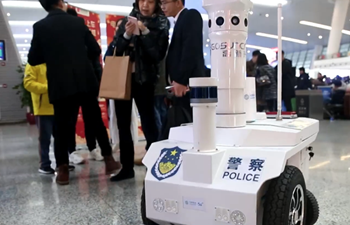 5G-assisted robot helps ensure travel rush security in China's Hangzhou