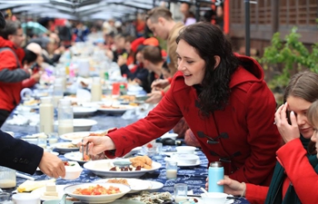 Foreigners attend activity featuring Chinese Lunar New Year customs in China's Zhejiang