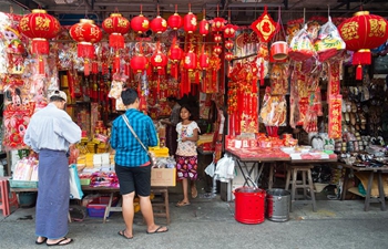 People purchase decorations for upcoming Chinese Lunar New Year in Yangon, Myanmar